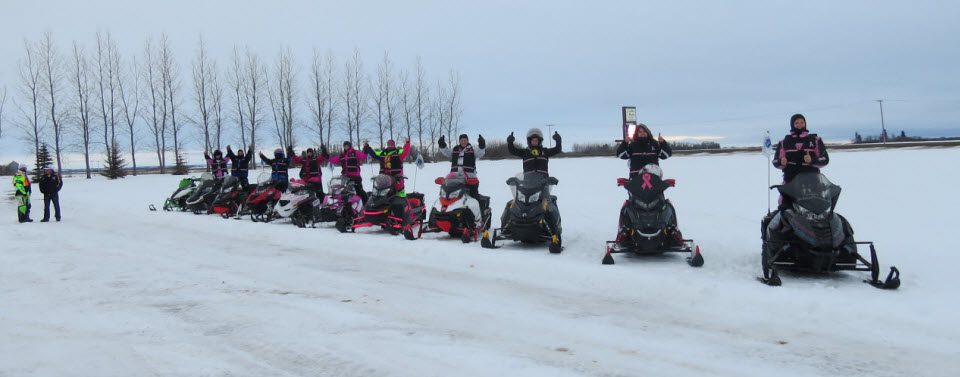 caravan of snowmobiles
